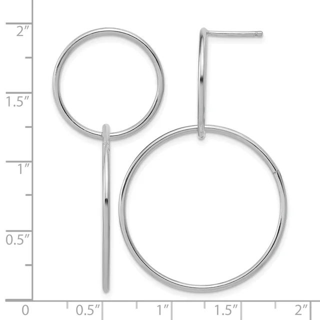 Two silver hoop earrings of different sizes connected by a thin post, displayed against a measurement scale showing approximately two inches in height.