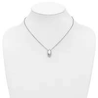 A silver teardrop-shaped pendant hangs from a delicate chain on a white mannequin bust.
