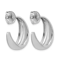 A pair of polished silver hoop earrings with textured flower-shaped post backs, displayed against a white background.