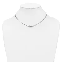 A delicate silver choker necklace with a small round pendant displayed on a white mannequin bust.
