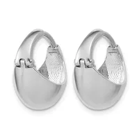 A pair of polished silver chunky hoop earrings with a textured interior surface and hinged closures, shown from the front.
