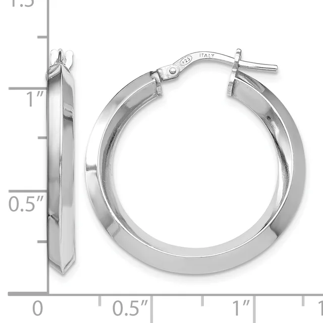 A pair of polished silver-toned hoop earrings with a squared profile, shown next to a measurement ruler indicating approximately one inch in diameter.