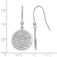 Silver drop earrings with circular pendants featuring horizontal stripe texture and small round crystal accents, shown on measurement scale.