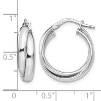 A pair of polished silver-toned hoop earrings with a chunky curved profile, shown next to a measurement ruler indicating approximately one inch in height.