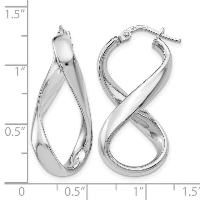 Two silver twisted hoop earrings with lever-back closures, displayed next to a ruler showing they measure approximately 1.25 inches in length.