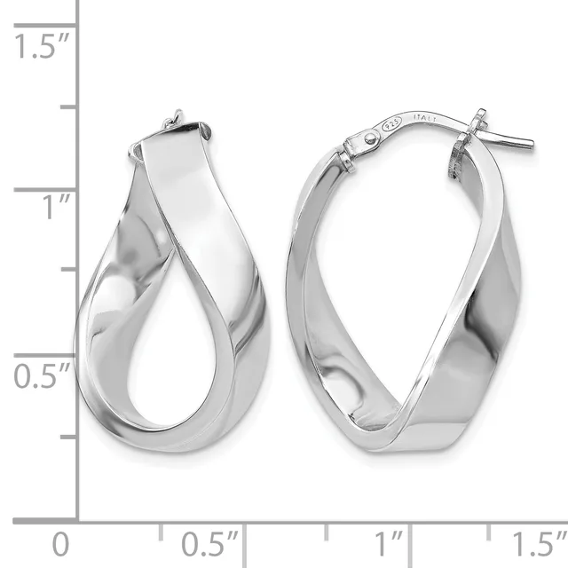 A pair of polished silver twisted hoop earrings with post and clutch closures, displayed against a measurement scale showing approximately one inch in height.