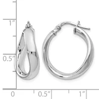 A pair of polished silver-toned hoop earrings with a twisted design, shown next to a ruler indicating they measure approximately one inch in length.