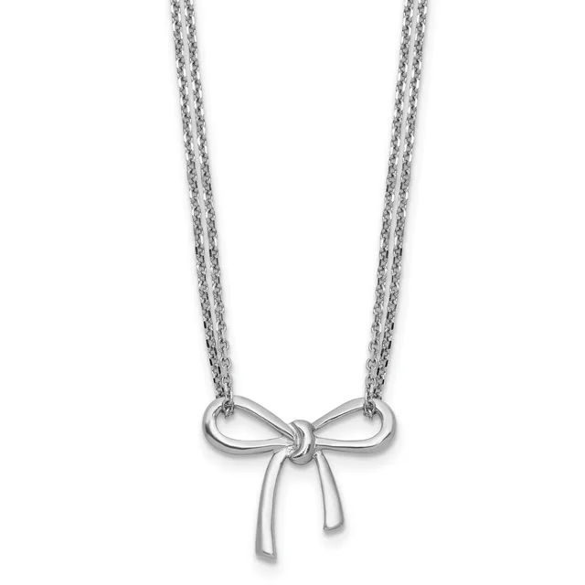 Silver-toned bow pendant necklace with double chain strands on a white background.