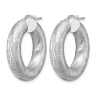 A pair of silver textured hoop earrings with a brushed finish and post-and-clutch closures.