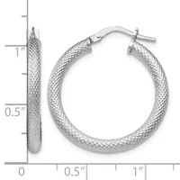 Silver textured hoop earrings with a mesh pattern and hinged closure, shown next to a measurement ruler indicating approximately one inch in diameter.