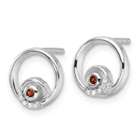 Pair of silver oval hoop earrings with round red gemstones and white stone accents set at the bottom, displayed against a white background.