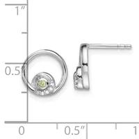 Silver circular earrings with peridot centers surrounded by diamond accents, shown front and side view with measurement scale indicating approximately half-inch diameter.