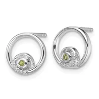 A pair of silver circular earrings with green peridot stones set in textured bezels and post backs.