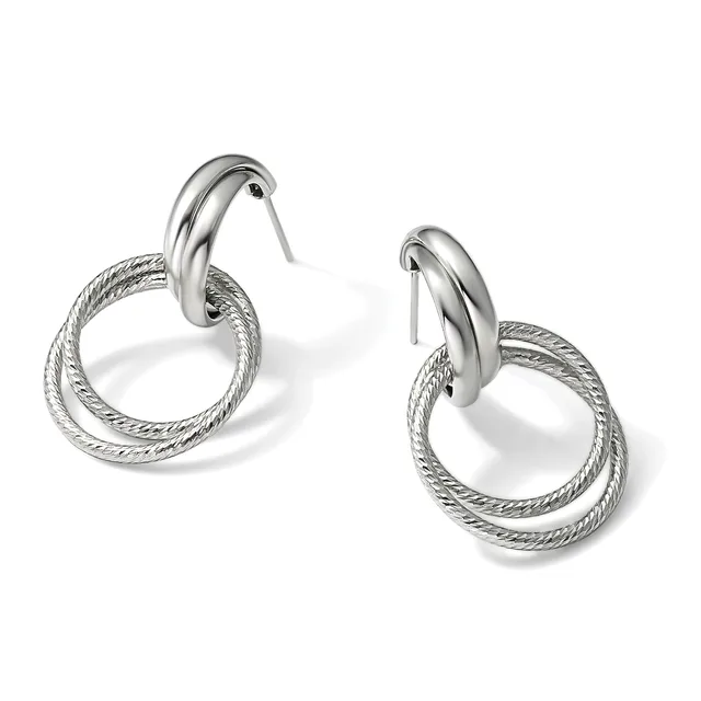 A pair of silver-toned double hoop earrings with textured outer rings and polished inner hoops, displayed against a white background.