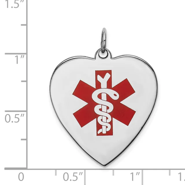 Heart-shaped medical alert pendant with red star of life symbol and caduceus, shown next to ruler indicating approximately one inch width.
