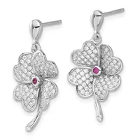 Pair of silver four-leaf clover drop earrings with diamond pavé petals, small ruby stone centers, and stem details, shown from front and back views.