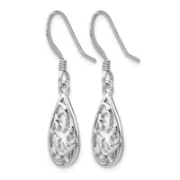 A pair of silver teardrop earrings with ornate filigree patterns, suspended from curved ear wires.