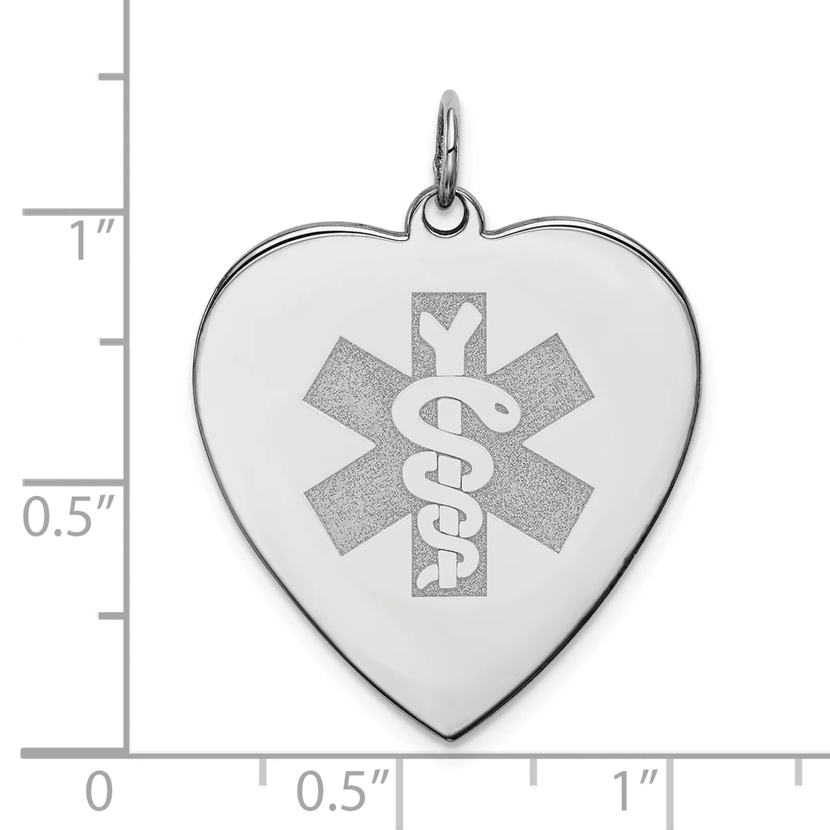 Heart-shaped medical alert pendant with engraved Star of Life symbol and staff, shown next to a ruler indicating approximately one inch in height.