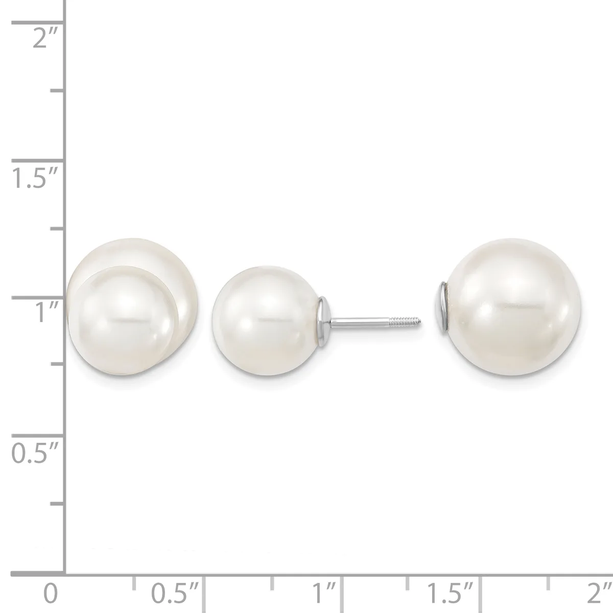 Three white pearl stud earrings displayed on a ruler showing sizes ranging from approximately one inch to two inches in diameter.