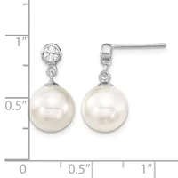 A pair of silver drop earrings with round white pearls suspended below round cubic zirconia stones, shown next to a measurement ruler.