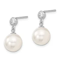 Pair of silver drop earrings with round white pearls suspended below bezel-set round cubic zirconia studs on posts.
