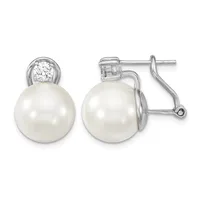 Pair of silver earrings with white pearl drops topped by round diamond studs, shown from front and side views.