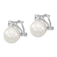 A pair of silver earrings with white pearl drops and small square-cut cubic zirconia stones mounted on curved ear wires with omega backs.