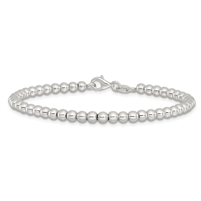 A silver beaded bracelet with uniformly sized polished spheres strung together and fastened with a lobster claw clasp.
