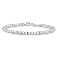 A silver beaded bracelet with uniformly sized polished spheres strung together and fastened with a lobster claw clasp.