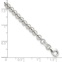 Silver-toned beaded bracelet with round polished spheres connected by small spacer rings, ending with a lobster clasp, displayed against a measurement scale.