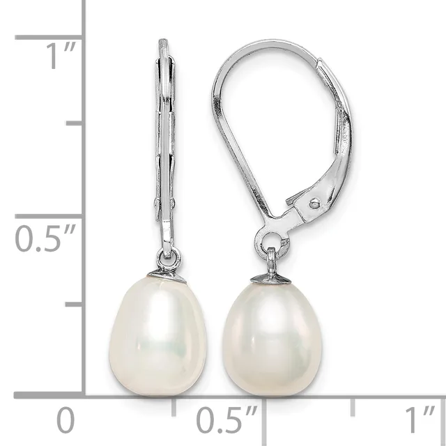 A pair of silver lever-back earrings with white pearl teardrop drops, shown next to a ruler indicating approximately one inch in length.