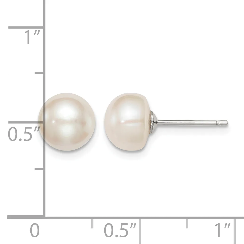 A pair of white pearl stud earrings displayed next to a ruler showing they measure approximately 0.5 inches in diameter.