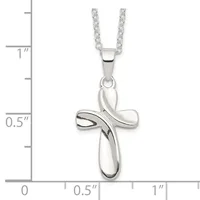 A silver cross pendant with a twisted ribbon design hanging from a silver chain, shown against a measurement scale indicating approximately one inch in height.