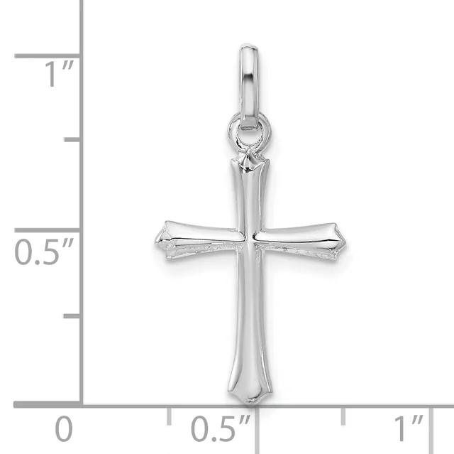 Silver cross pendant with rounded ends and textured surface, shown with measurement scale indicating approximately one inch in height.