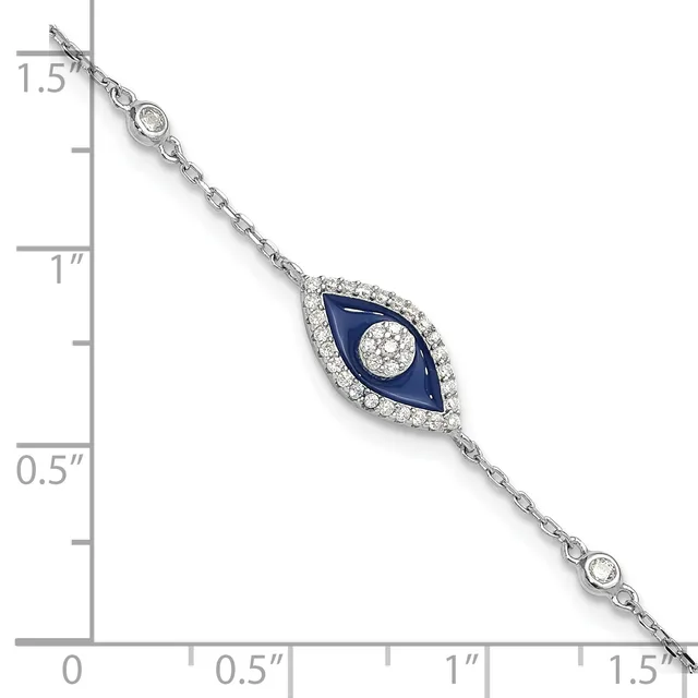 Silver bracelet with an evil eye pendant featuring dark blue enamel and diamonds, shown next to a measurement scale.