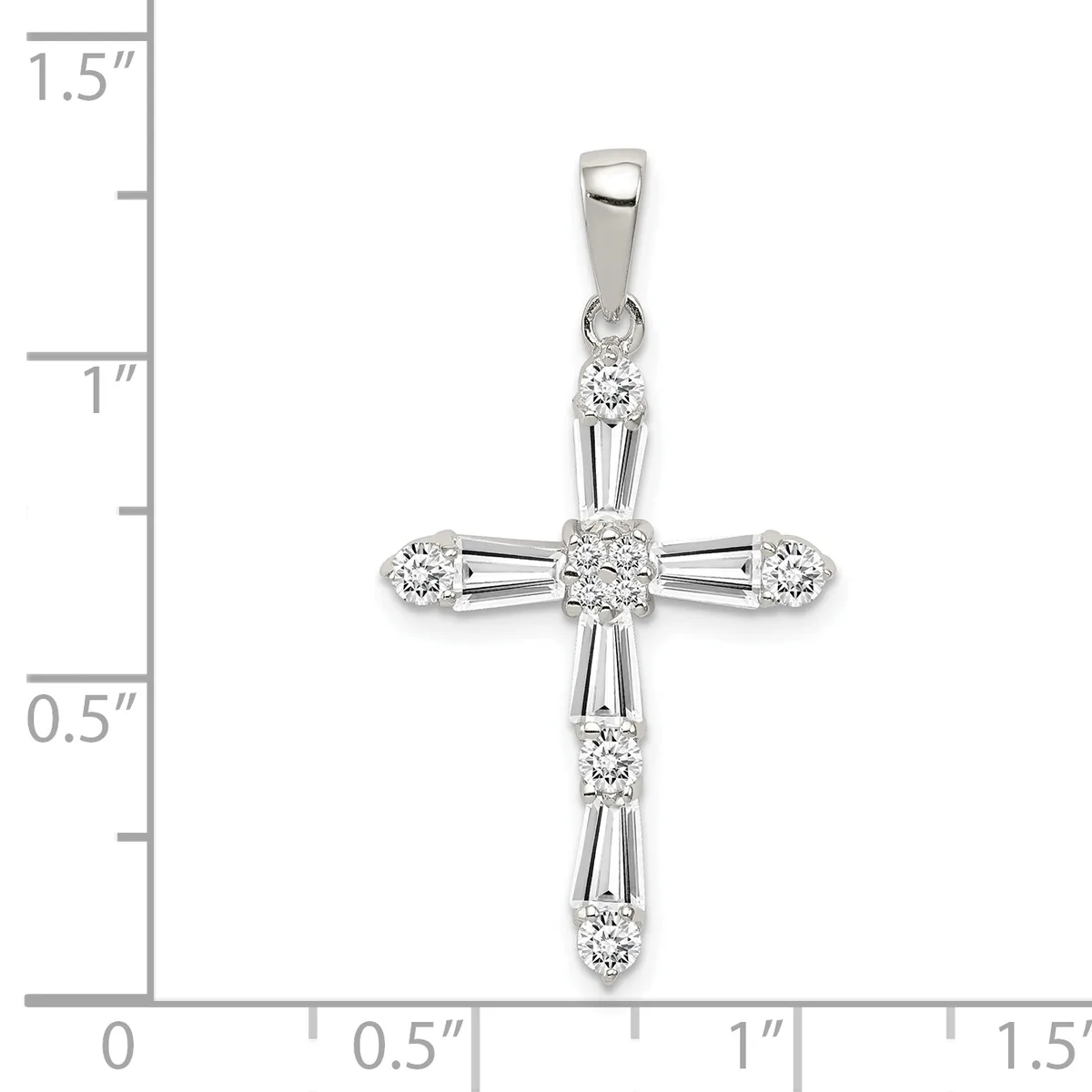 White gold cross pendant with round and baguette-cut diamonds arranged in a decorative pattern, shown against a measurement scale indicating approximately one inch in width.