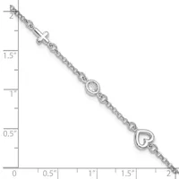 Silver bracelet with a cross charm, a cubic zirconia stone, and a heart charm, displayed against a measurement scale showing approximately two inches in length.
