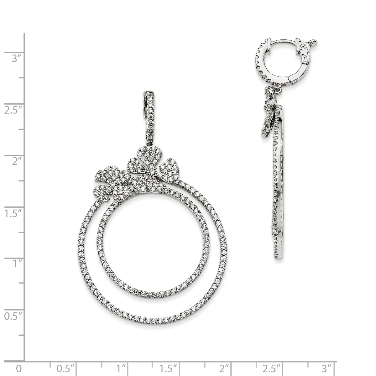 Two diamond earrings with double circular drop pendants and small decorative tops, displayed against a measurement scale showing approximately 3 inches in length.
