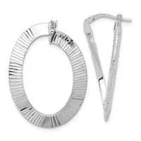 A pair of silver textured oval hoop earrings with ridged surfaces and post-and-clutch closures, displayed against a white background.