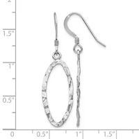 A pair of silver-toned fish hook earrings with textured oval pendants, displayed on a measurement scale showing approximately 1.5 inches in length.