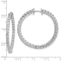 A pair of silver hoop earrings with diamond pavé setting shown from front and side views against a measurement scale.