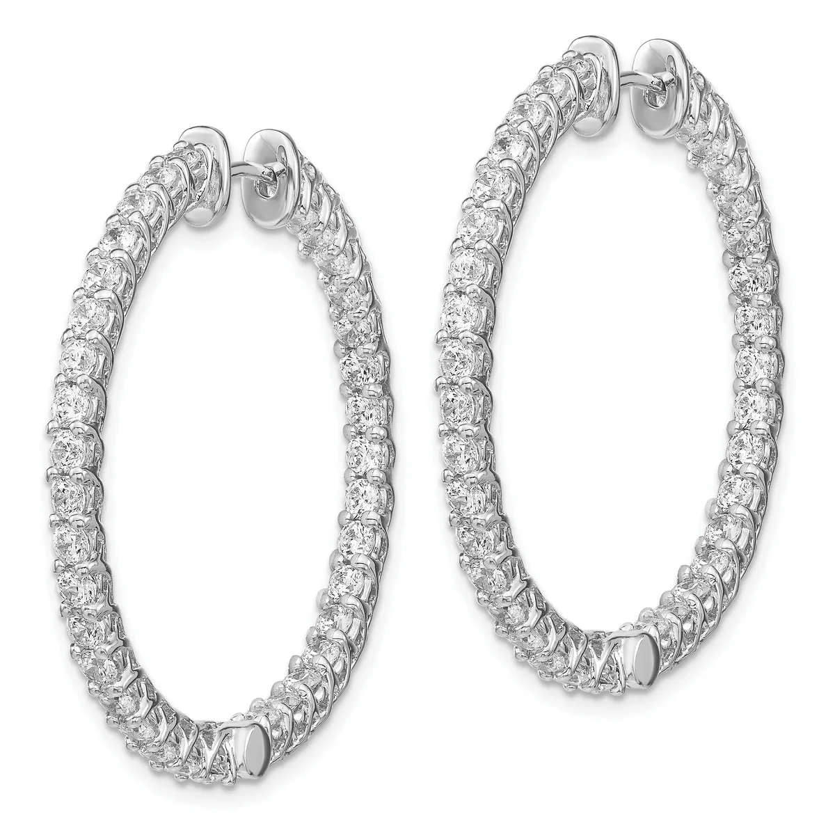 A pair of oval diamond hoop earrings in white metal with round brilliant diamonds set along the entire outer surface, shown from the front at slightly different angles.