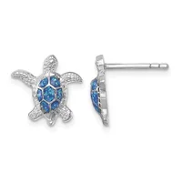 Pair of silver sea turtle stud earrings with blue opal inlay on the shell and textured fins, shown from front and side views.