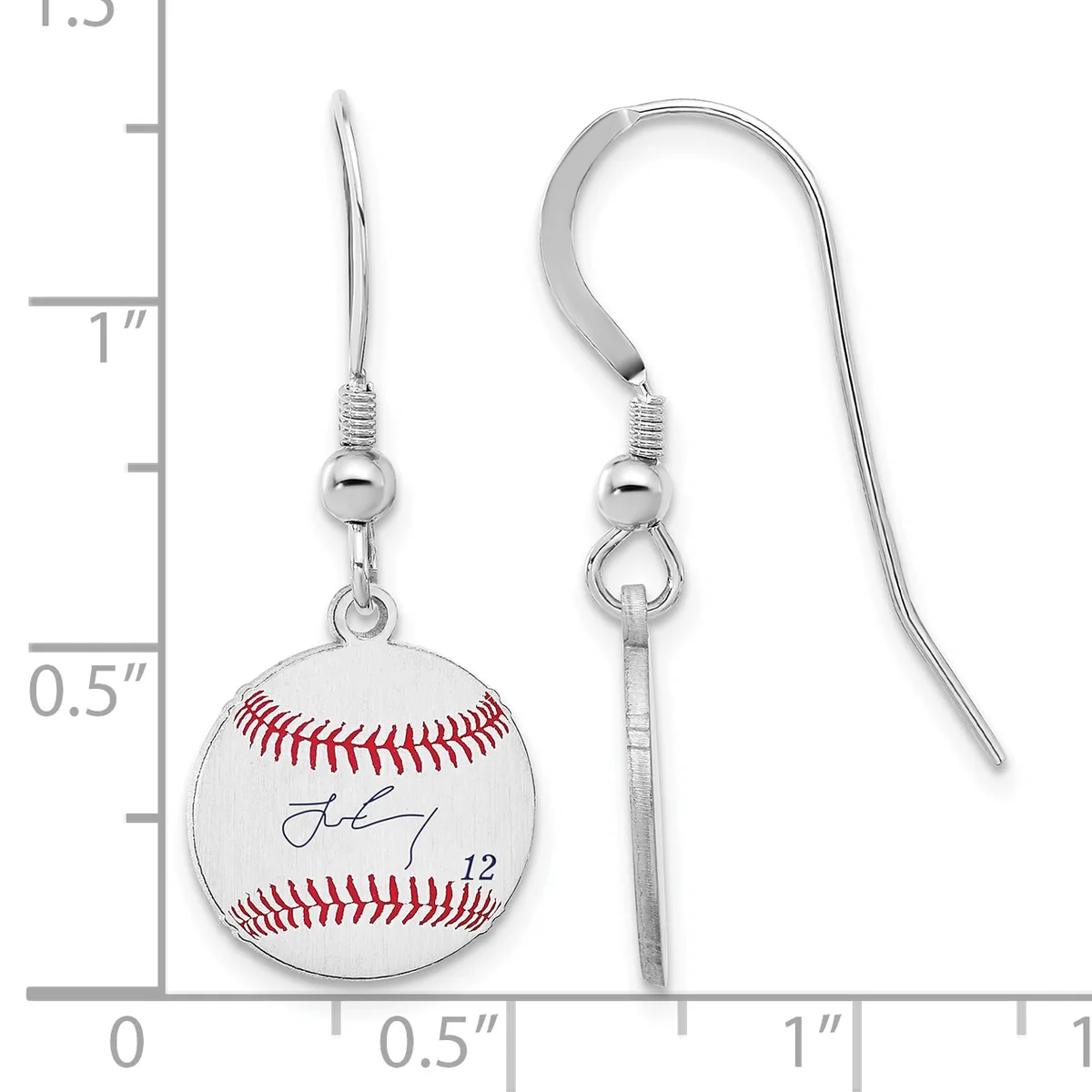 Pair of silver-toned fish hook earrings with baseball-themed charms featuring red stitching and a signature, displayed against a measurement scale.
