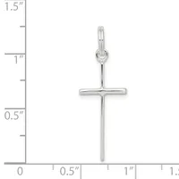 A silver cross pendant with a polished finish and small loop at the top, displayed against a ruler showing it measures approximately 1.25 inches in length.