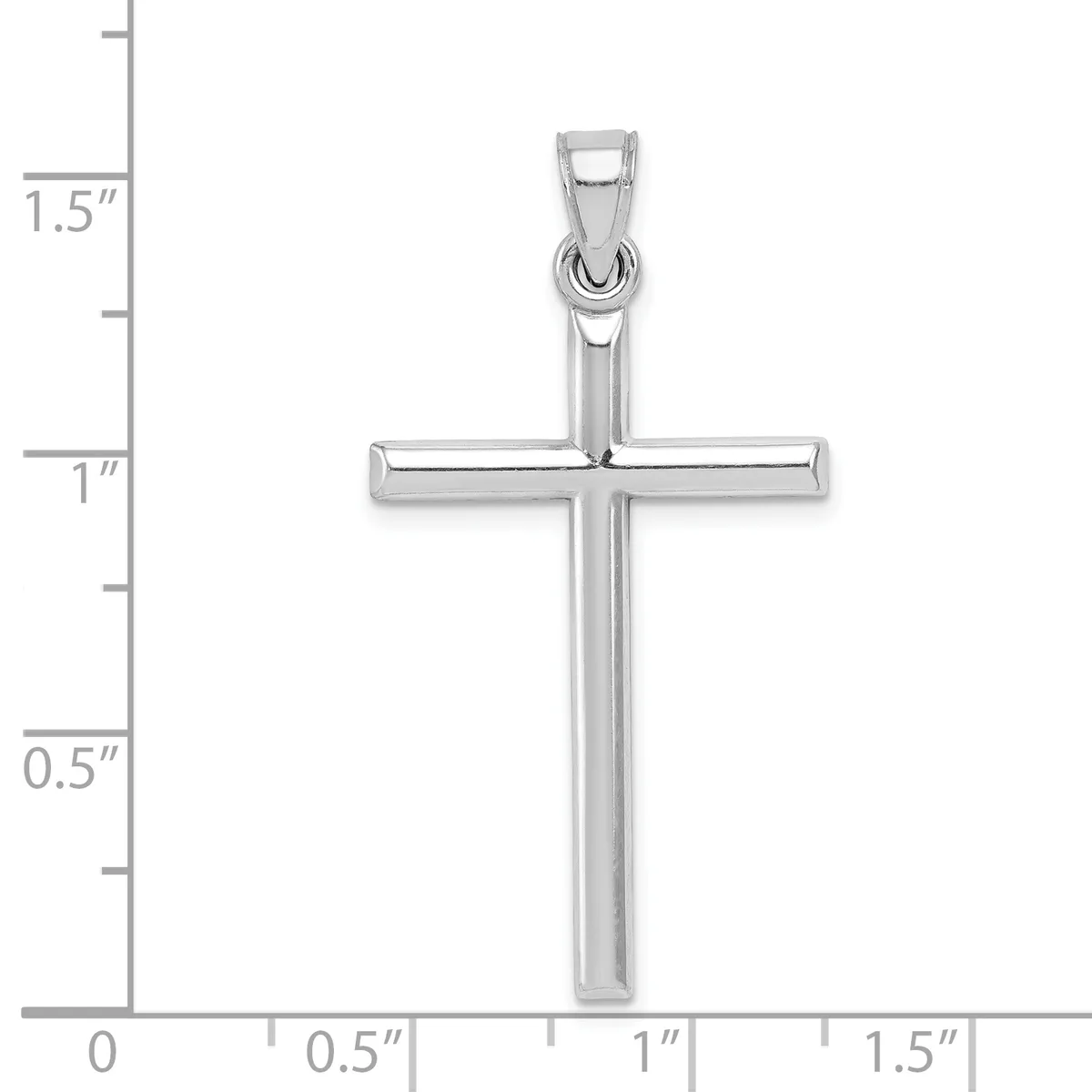 A polished silver cross pendant shown against a measurement scale indicating it is approximately one inch wide and one and a half inches tall.