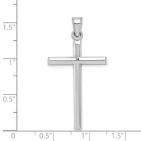 A polished silver cross pendant shown against a measurement scale indicating it is approximately one inch wide and one and a half inches tall.