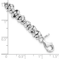 Silver-toned twisted link bracelet with lobster clasp, shown next to ruler indicating approximately 7 inches in length.