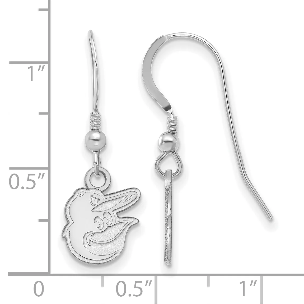 A pair of silver fish-shaped dangle earrings with French wire hooks, displayed next to a measurement scale showing approximately one inch in length.