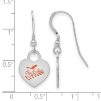A pair of silver-toned heart-shaped dangle earrings with orange enamel design, displayed next to a measurement ruler showing approximately one inch in length.